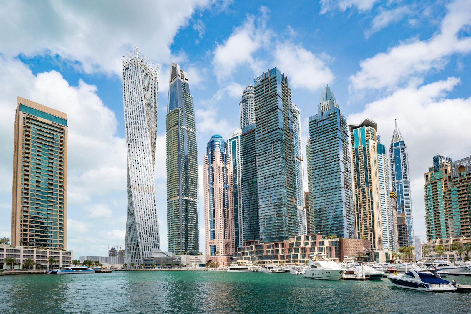 Stunning view of Dubai Marina's iconic skyline with high-rise skyscrapers and calm waterfront.